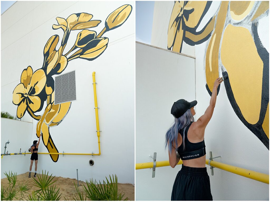 Alli-K-Design-painting-an-Oralndo-mural-at-the-Evermore