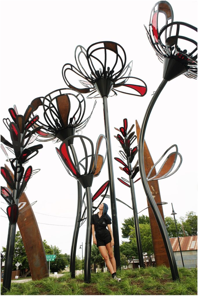 Dallas artist Alli Koch with her public sculpture in McKinney, TX