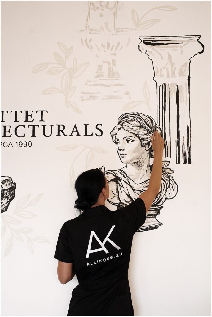 Alli Kock painting a mural for Pittet Architecturals Dallas TX in the Dallas Design District