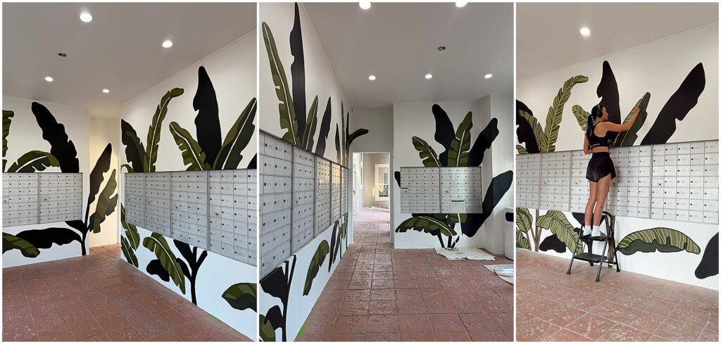 Alli Koch of Alli K Design painting a mural in a Houston apartment complex's mailroom