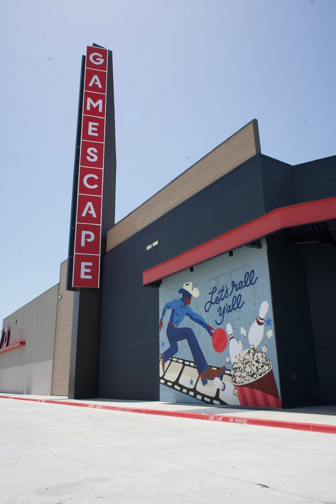 A mural at Cinemark Gamescape in Greenville, TX painted by Dallas artist Alli K Design